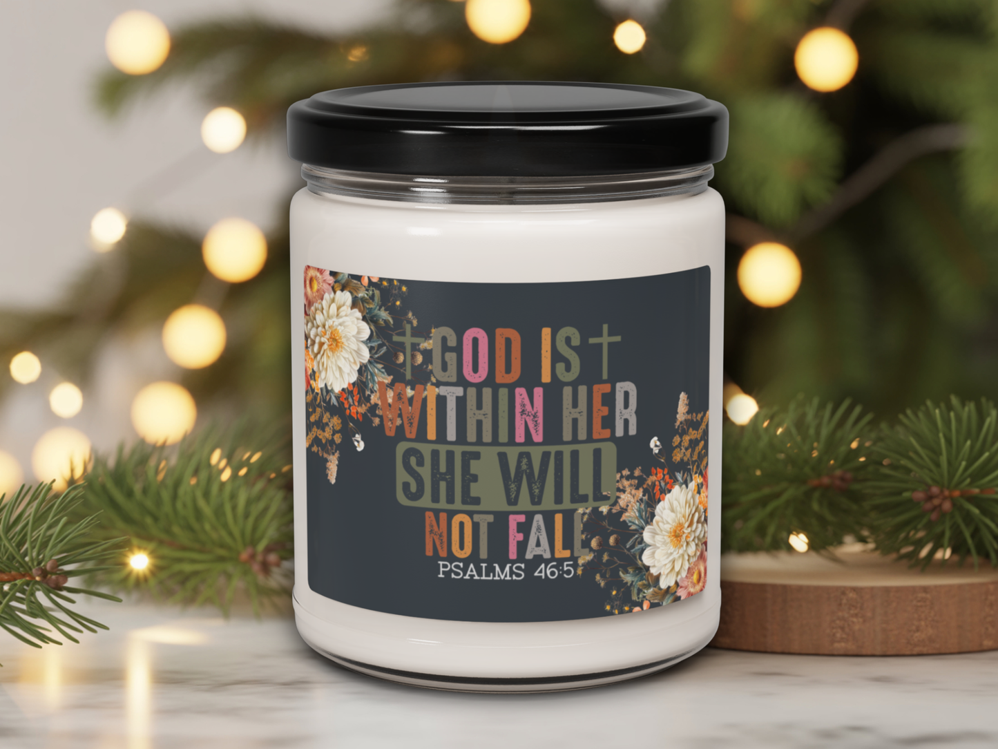 Candle jar with motivational quote against a festive background