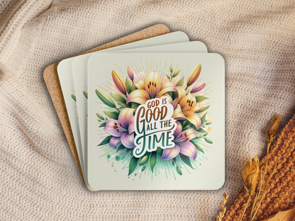 Stack of cork-backed floral coasters with scripture design, placed on a cozy knit blanket with dried flowers.