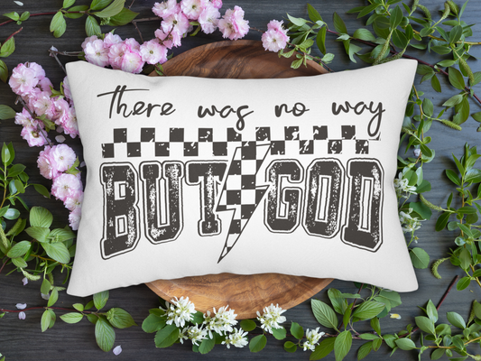 Decorative pillow with text 'There was no way but God' surrounded by flowers and leaves on a dark surface
