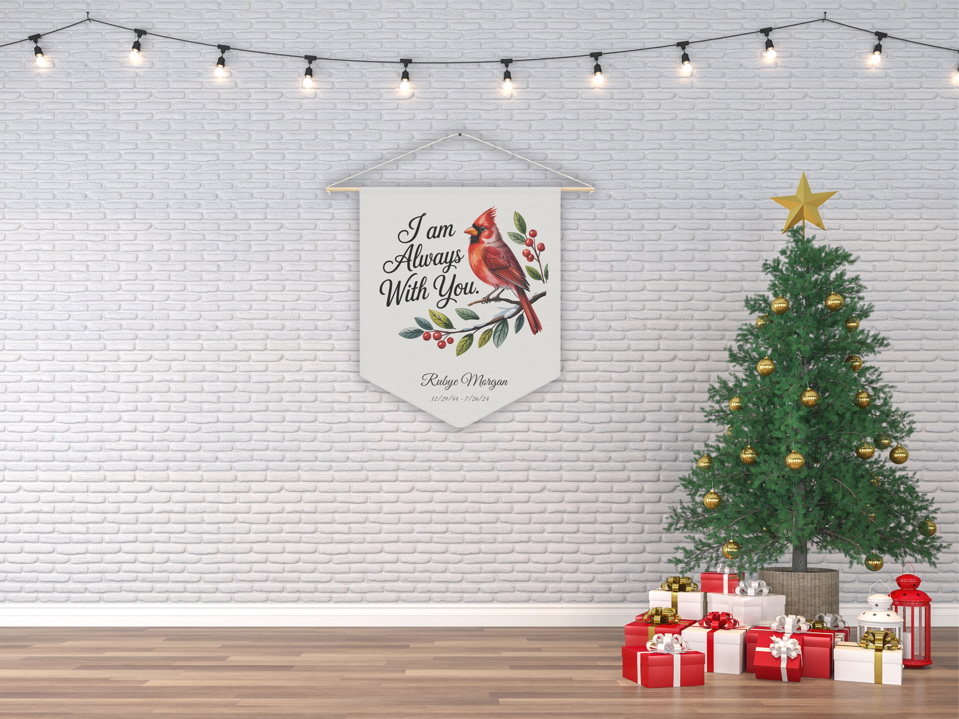 Decorative banner with cardinal design hanging on a white brick wall with a Christmas tree and presents below.