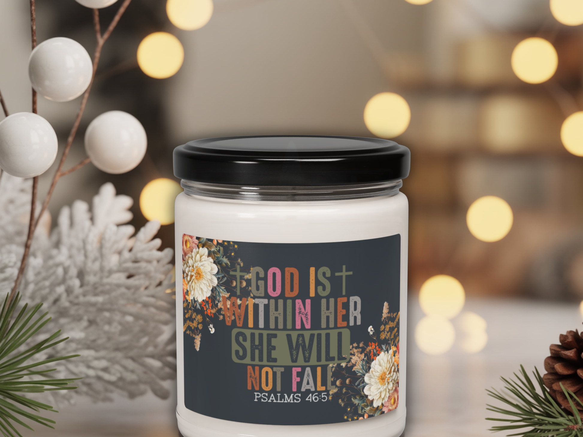 Candle jar with motivational quote label against a festive background