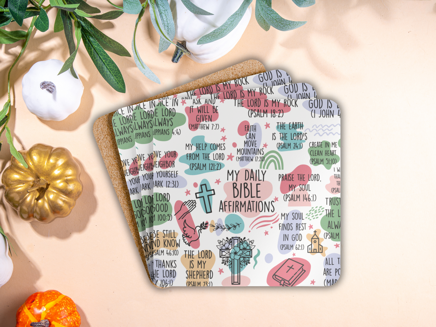Stack of affirmation coasters with cork backing, styled with pumpkins and greenery for a cozy fall-inspired look.