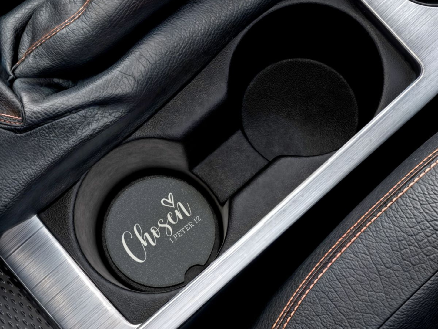 Car cup holder with a navy cup holder cover featuring 'Chosen' text.