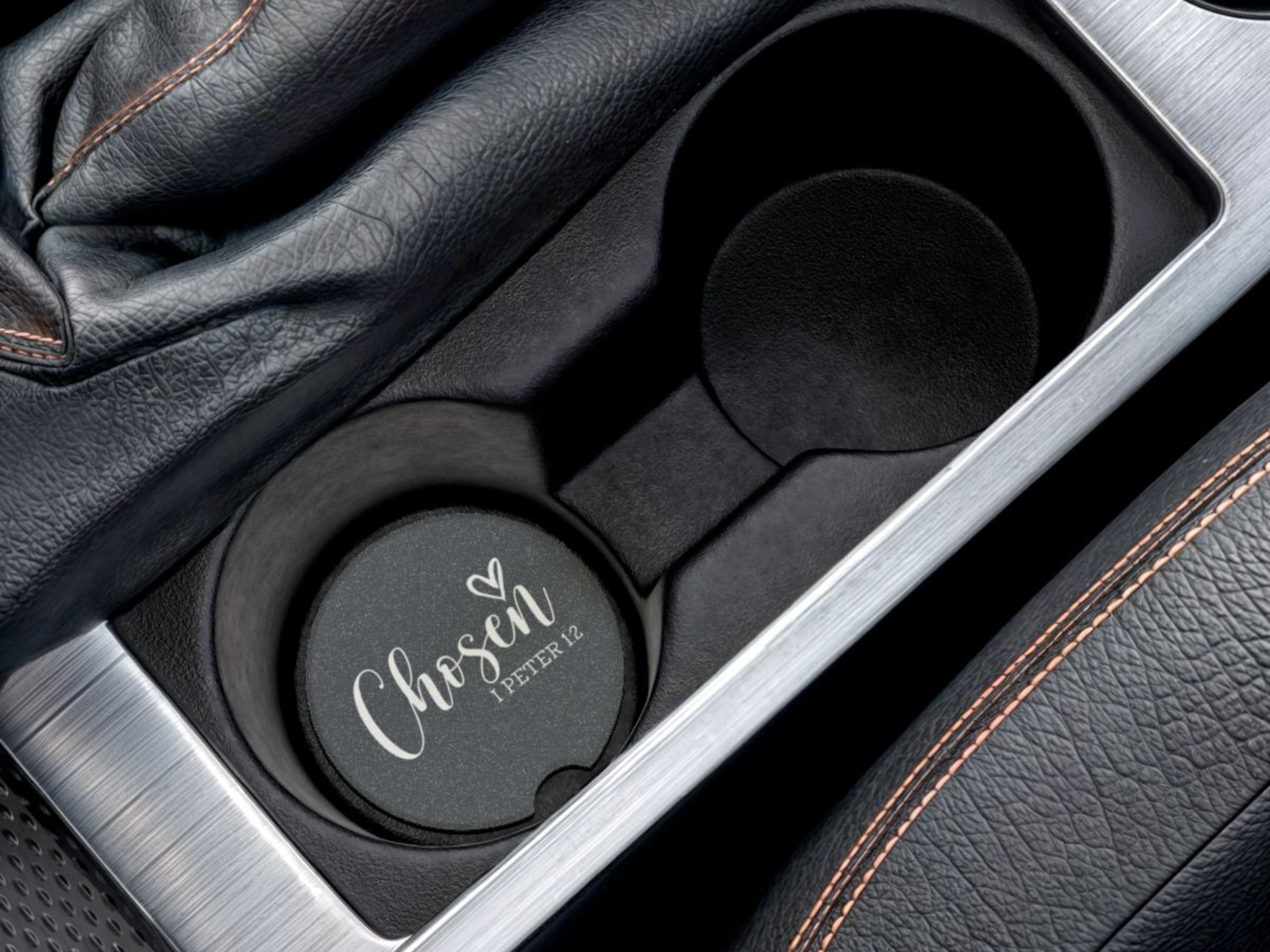 Car cup holder with a navy cup holder cover featuring 'Chosen' text.