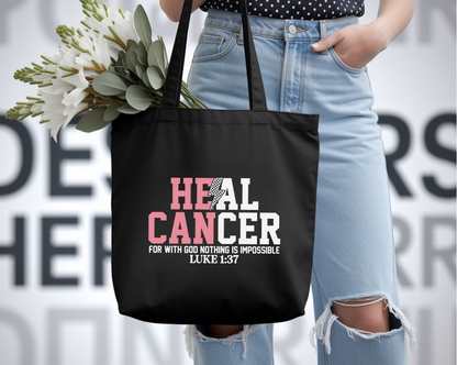 Person holding a black tote bag with 'HEAL CANCER' text, wearing light blue jeans and holding flowers.