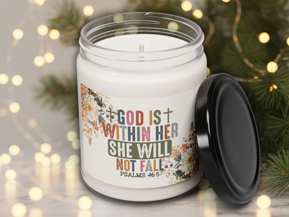 Candle jar with motivational quote and floral design on a blurred festive background
