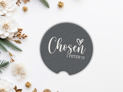Round navy coaster with 'Chosen I Peter 1:2' text on a decorative background with flowers and greenery.