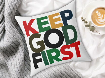 Pillow with 'KEEP GOD FIRST' text on a white surface with a cup of coffee.