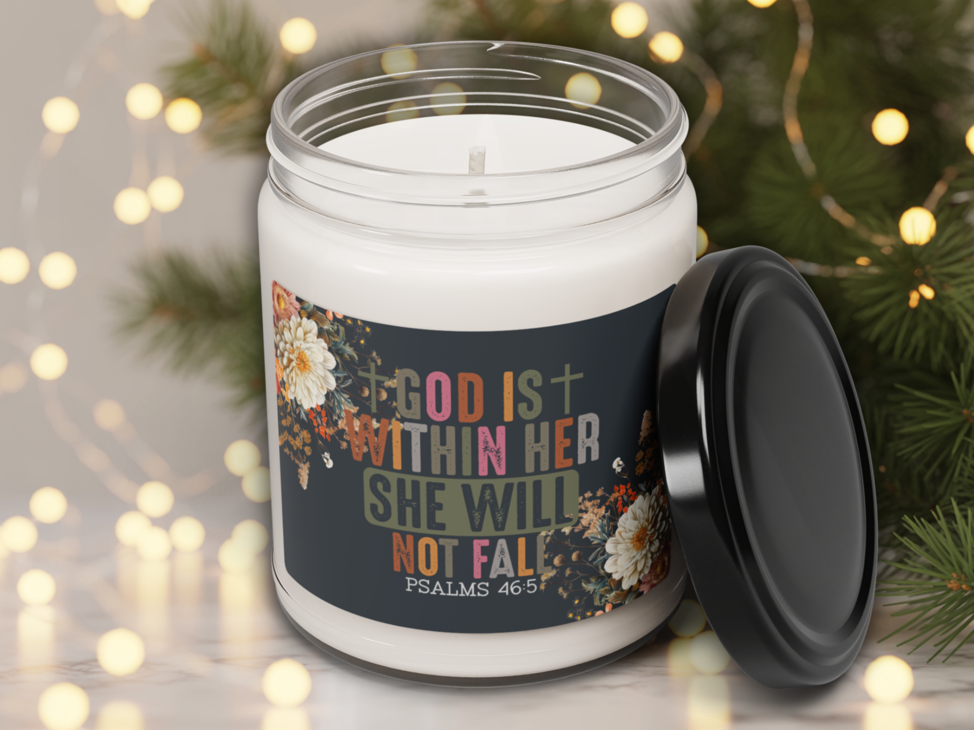 Candle in a jar with a motivational label against a festive background