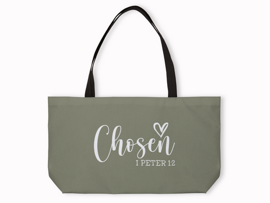 Olive green weekender tote with black straps featuring “Chosen – I Peter 1:2” in white script with heart detail.