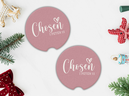 Two pink coasters with 'Chosen 1 Peter 1:2' text on a white background with Christmas decorations.
