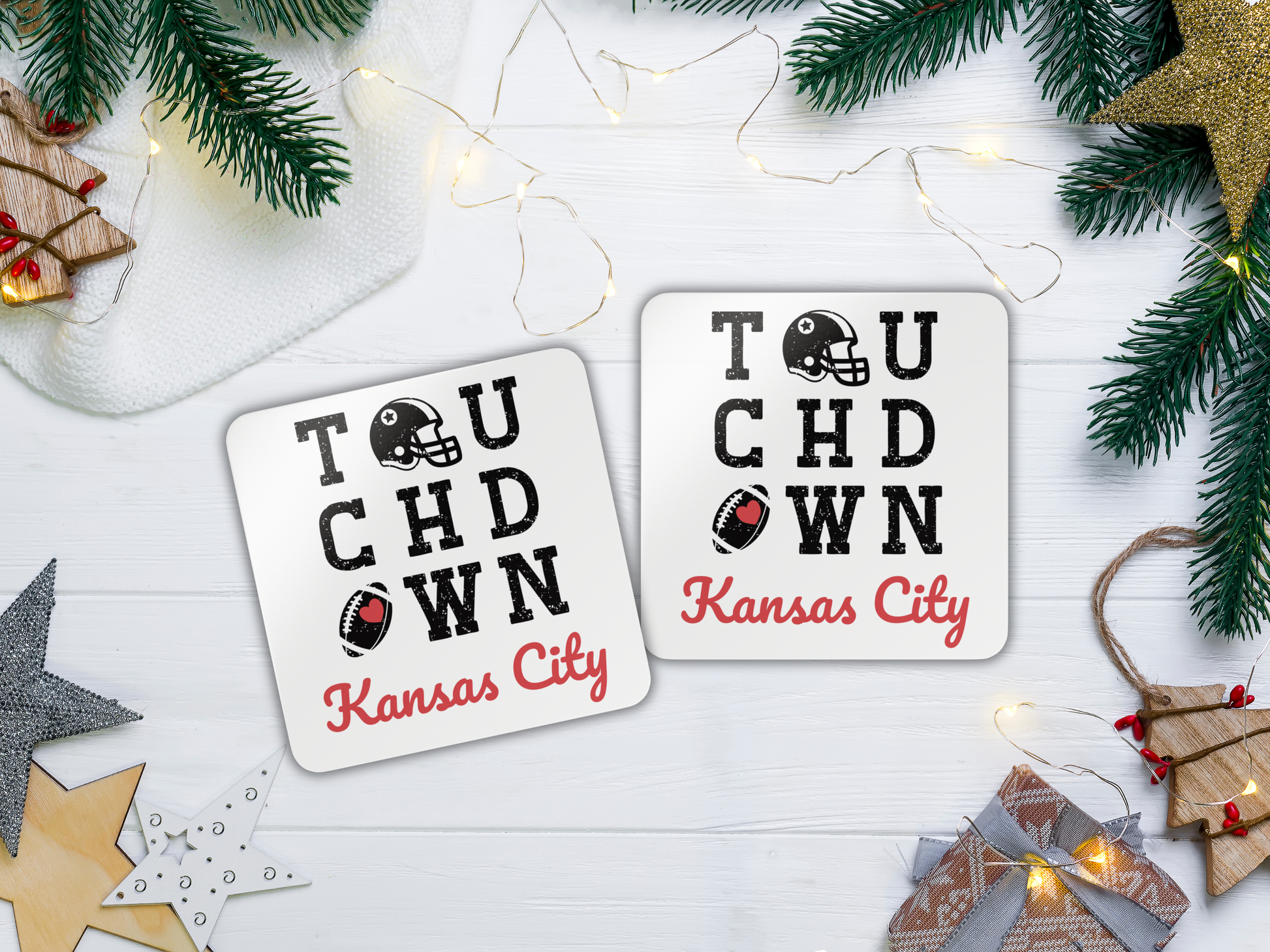 Two 'Touchdown Kansas City' coasters on a festive background with Christmas decorations.
