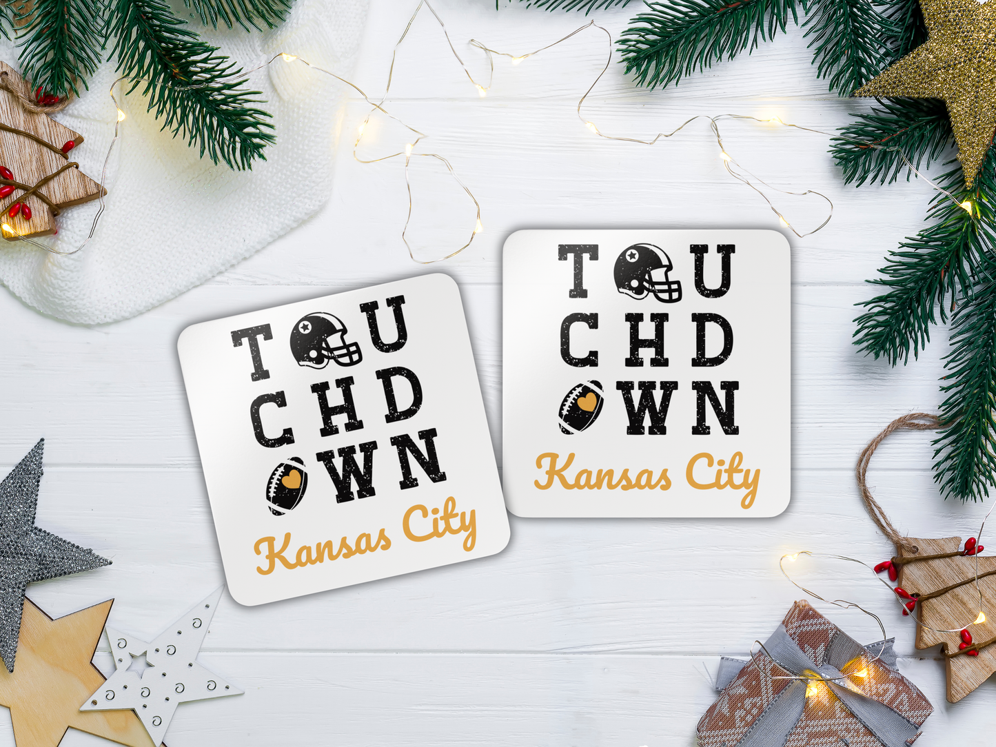 Two 'Touchdown Kansas City' coasters on a festive background with Christmas decorations.