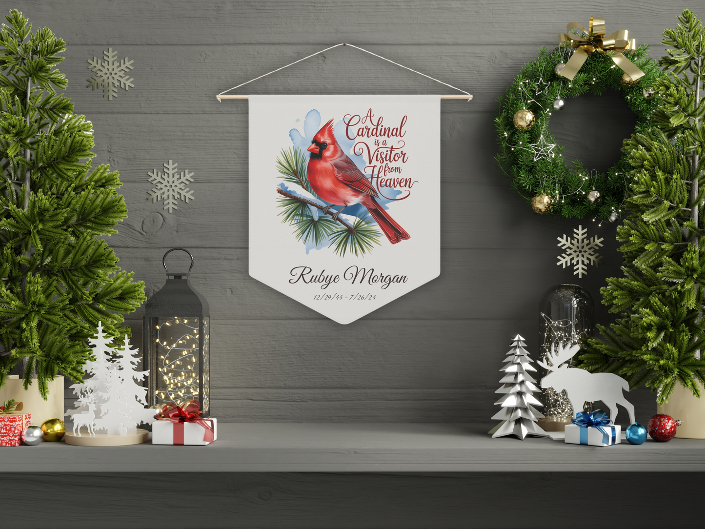 Decorative wall pennant with cardinal illustration on a wall with Christmas decorations