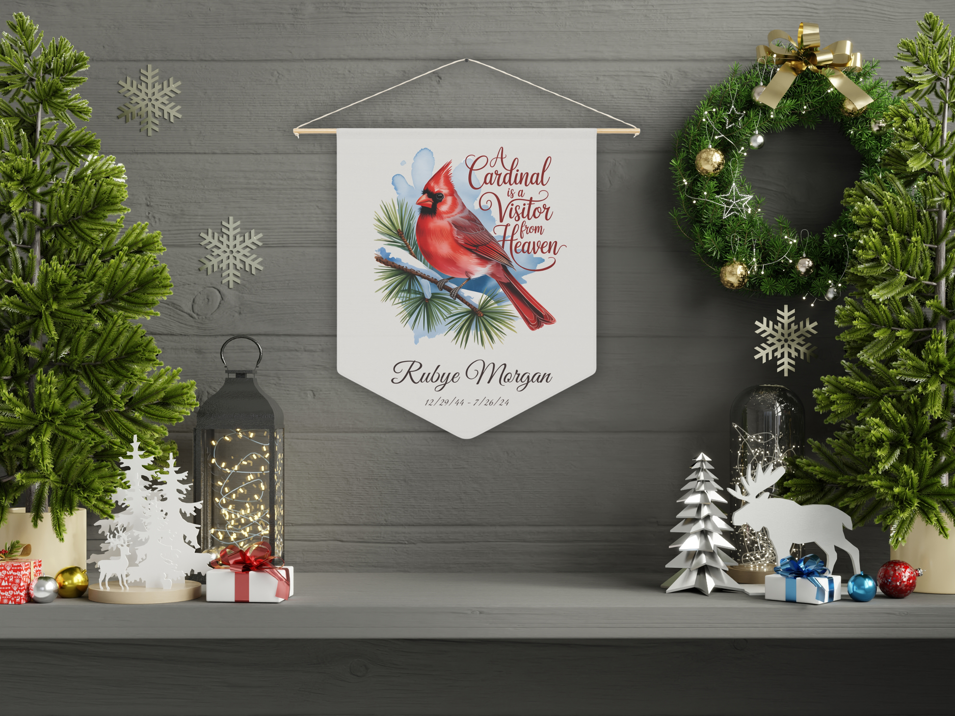Decorative wall pennant with cardinal illustration on a wall with Christmas decorations
