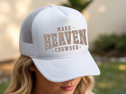 White trucker hat with leopard print text worn by a person outdoors.
