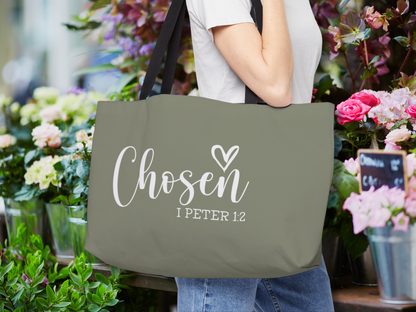 “Chosen” weekender tote carried over the shoulder in a flower shop surrounded by colorful blooms.