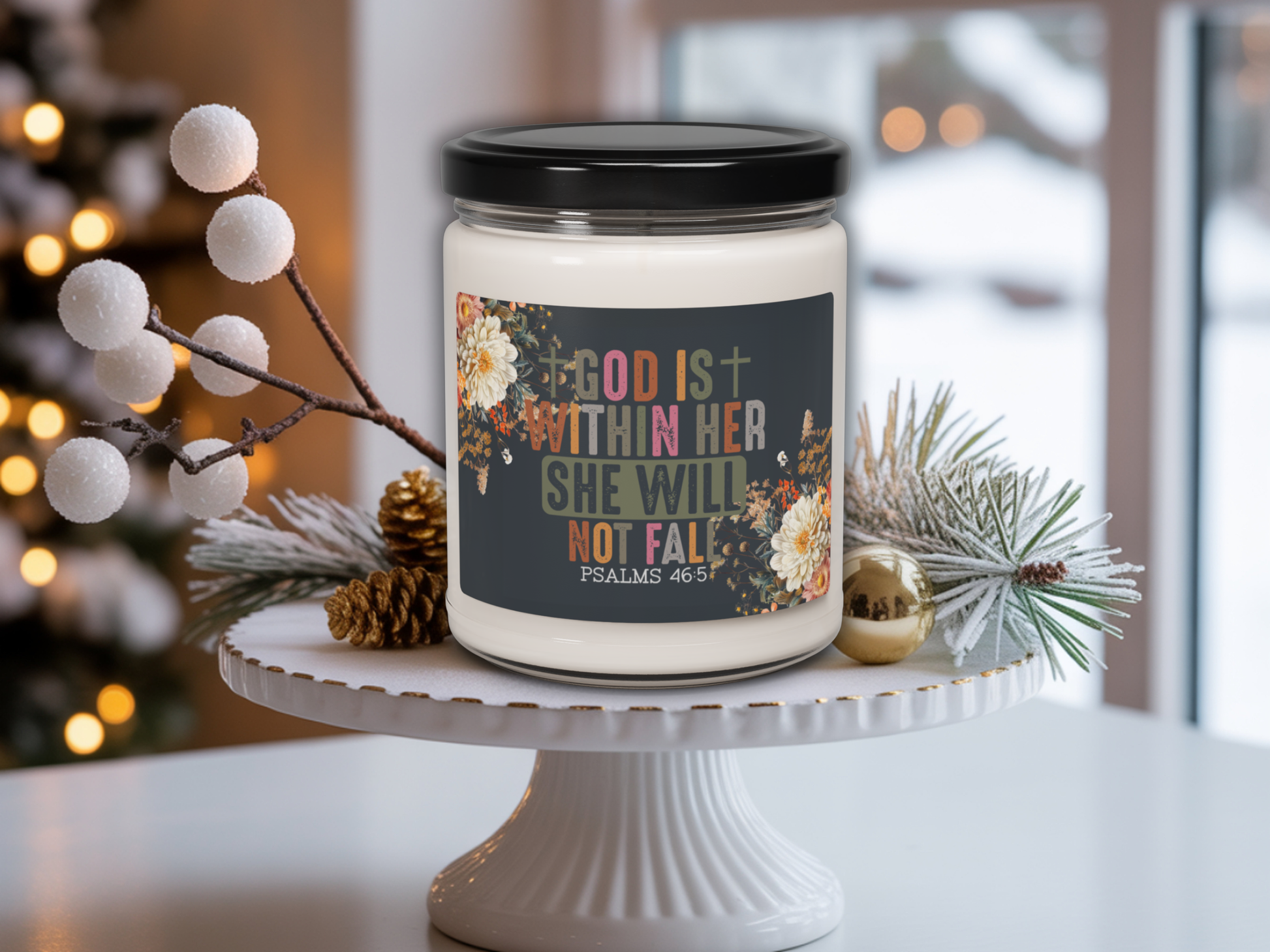 Candle jar with a motivational quote on a white surface with decorative elements.