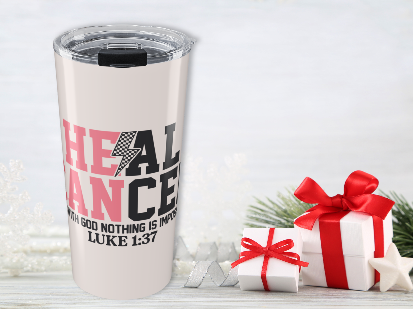 Tumbler with motivational quote and Christmas presents on a white background