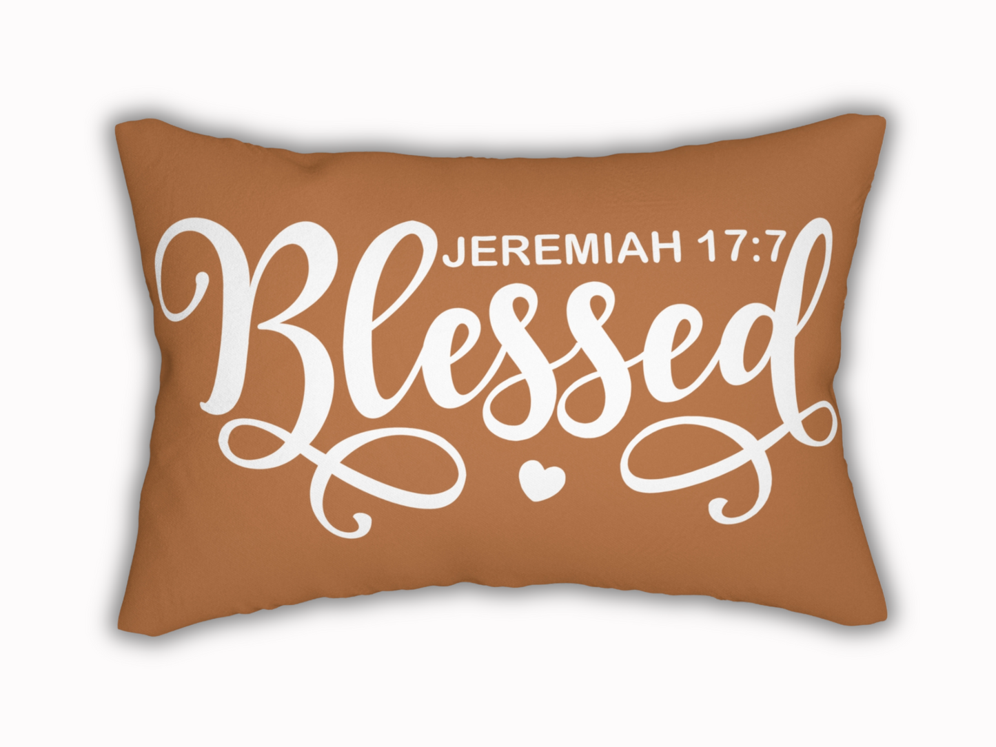 Brown lumbar pillow with “Blessed – Jeremiah 17:7” in bold white script and heart detail.
