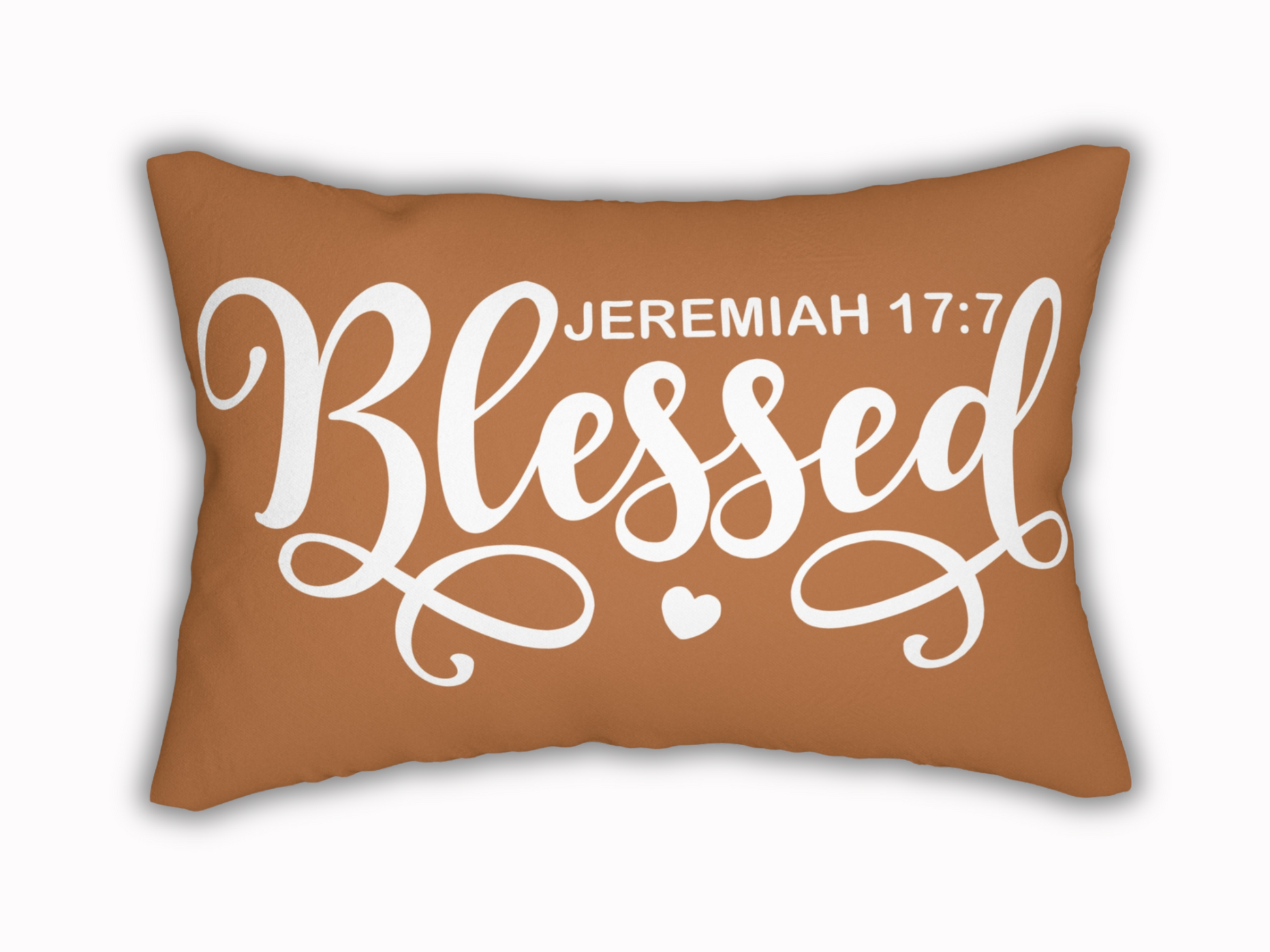 Brown lumbar pillow with “Blessed – Jeremiah 17:7” in bold white script and heart detail.
