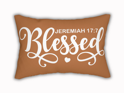 Brown lumbar pillow with “Blessed – Jeremiah 17:7” in bold white script and heart detail.