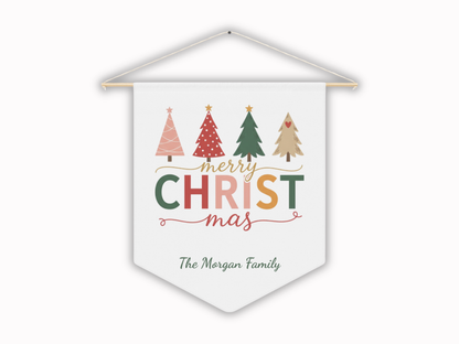 Decorative Christmas banner with trees and 'Merry Christmas' text on a white background