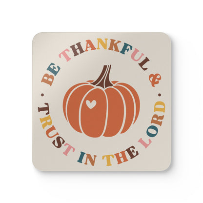 Coaster with pumpkin design and text 'Be Thankful & Trust in the Lord' on a beige background