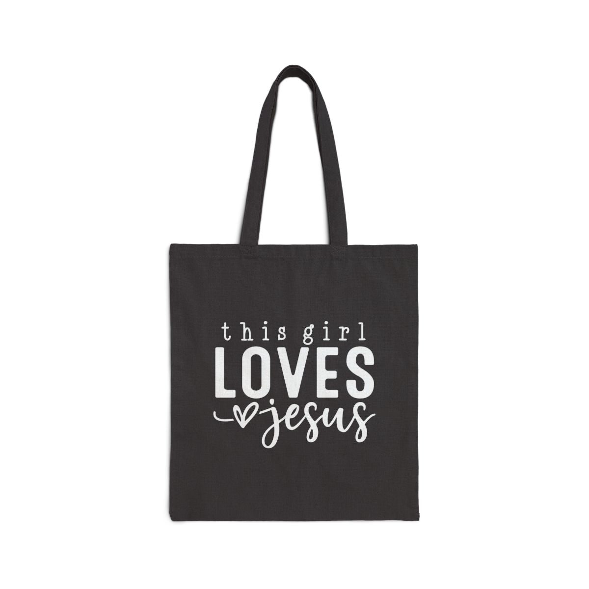Black tote bag with 'this girl LOVES Jesus' text on a white background