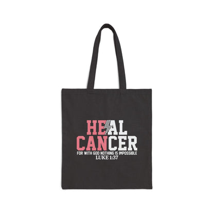 Black tote bag with 'HEAL CANCER' text and Bible verse on a white background