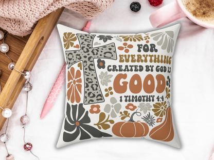 Fall scripture pillow with leopard print cross, pumpkins, and flowers reading “For everything created by God is good – 1 Timothy 4:4,” styled with tray, pen, and coffee.