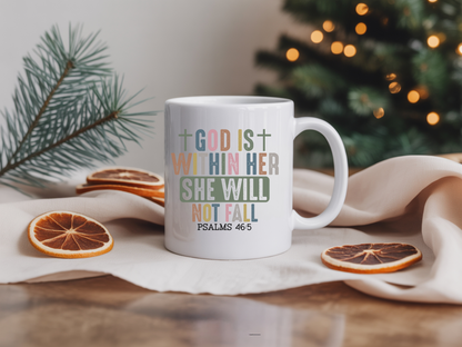 White mug with motivational quote on a table with Christmas decorations